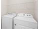 Convenient laundry room with a side-by-side washer and dryer at 1524 Remington Trace Dr, Port Charlotte, FL 33953