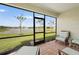 Enjoy the view from this screened patio overlooking a beautiful lake at 1524 Remington Trace Dr, Port Charlotte, FL 33953