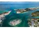 Wonderful aerial view of a coastal community with turquoise waterways, islands, and beautiful homes, perfect for relaxed living at 1582 Overbrook Rd, Englewood, FL 34223
