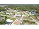 Gorgeous aerial view of a neighborhood with lush landscapes, a river, and beautiful single-Gathering homes at 1582 Overbrook Rd, Englewood, FL 34223