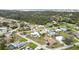 Neighborhood aerial showcasing the single-Gathering homes with mature trees and proximity to the water at 1582 Overbrook Rd, Englewood, FL 34223