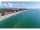 Scenic aerial view of a serene beach with clear water, perfect for a relaxing getaway at 1582 Overbrook Rd, Englewood, FL 34223