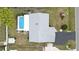 Aerial view of the house with a private pool, patio, and lush backyard at 1582 Overbrook Rd, Englewood, FL 34223
