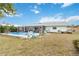 Backyard featuring a pool and a covered patio with outdoor seating at 1582 Overbrook Rd, Englewood, FL 34223