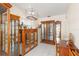 Charming dining area featuring classic wood display cases and bright lighting at 1582 Overbrook Rd, Englewood, FL 34223