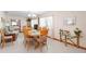 Spacious dining room with a wood table and chairs and a bright chandelier at 1582 Overbrook Rd, Englewood, FL 34223