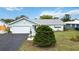 Well-maintained single-story home with a two-car garage and well manicured landscaping at 1582 Overbrook Rd, Englewood, FL 34223