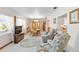 Cozy living room with a view of the dining room and comfortable seating at 1582 Overbrook Rd, Englewood, FL 34223