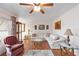 Comfortable living room featuring a large sectional sofa, hardwood floors, and a decorative area rug at 1582 Overbrook Rd, Englewood, FL 34223