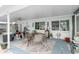 Relaxing covered patio with comfortable seating and charming decorative touches at 1582 Overbrook Rd, Englewood, FL 34223