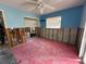 Blue bedroom under renovation with exposed walls and framing, offering potential for customization at 1782 Mississippi Ne Ave, St Petersburg, FL 33703
