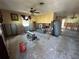 Living room renovation in progress showcasing open space with exposed wall studs and concrete floors at 1782 Mississippi Ne Ave, St Petersburg, FL 33703
