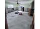 Bright living room undergoing renovations, featuring exposed walls, concrete flooring, and natural light at 1782 Mississippi Ne Ave, St Petersburg, FL 33703