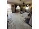 View of a living room undergoing renovation with exposed walls and concrete flooring at 1782 Mississippi Ne Ave, St Petersburg, FL 33703