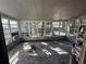 Enclosed sunroom filled with windows, offering lots of natural light and views of the outdoors at 1782 Mississippi Ne Ave, St Petersburg, FL 33703