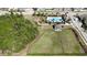 Aerial view of community amenities including pool, playground, dog park, and expansive green space at 1819 Redmond Brook Ln, Ruskin, FL 33570