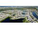 Aerial view of a single-Gathering home near multiple ponds in a residential neighborhood at 1819 Redmond Brook Ln, Ruskin, FL 33570