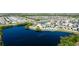 Aerial view of a single-Gathering home backing to a pond in a residential neighborhood at 1819 Redmond Brook Ln, Ruskin, FL 33570
