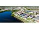 Aerial view of the property highlighting the backyard, pond, and community at 1819 Redmond Brook Ln, Ruskin, FL 33570