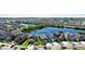 An aerial view of a single-Gathering home backing to a pond in a residential neighborhood at 1819 Redmond Brook Ln, Ruskin, FL 33570