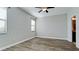 Bright, empty bedroom with hardwood floors, neutral walls, and large windows with lots of natural light at 1819 Redmond Brook Ln, Ruskin, FL 33570