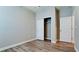 Bedroom featuring hardwood floors, neutral colored walls, and a closet at 1819 Redmond Brook Ln, Ruskin, FL 33570