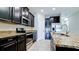 Modern kitchen with granite countertops and stainless steel appliances at 1819 Redmond Brook Ln, Ruskin, FL 33570