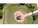 Aerial view of fenced playground with play structure, benches, and safety surfacing at 1819 Redmond Brook Ln, Ruskin, FL 33570