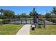 Community playground featuring swings, climbing structure, and picnic tables for Gathering fun at 1819 Redmond Brook Ln, Ruskin, FL 33570
