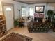 Cozy living room featuring a fireplace, comfortable seating, and plenty of natural light at 2014 6Th W Ave, Bradenton, FL 34205