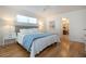 Bedroom with hardwood floors, ceiling fan and closet and an ensuite bathroom at 2466 Breakwater Cir, Sarasota, FL 34231