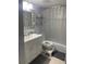 Bathroom featuring a silver framed mirror, a tub with a shower curtain and a white cabinet vanity at 2763 Woodgate Ln # 208, Sarasota, FL 34231