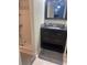 Bathroom featuring dark vanity with black countertop, a glass enclosed shower and neutral wall color at 2763 Woodgate Ln # 208, Sarasota, FL 34231