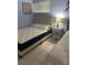 Bedroom with two twin beds and a padded headboard at 2763 Woodgate Ln # 208, Sarasota, FL 34231