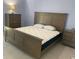 Bedroom with a padded bed, tile floor, and side tables at 2763 Woodgate Ln # 208, Sarasota, FL 34231