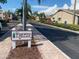 Street view within the Pinewood Village community showcasing well-maintained streets and landscaping at 2763 Woodgate Ln # 208, Sarasota, FL 34231