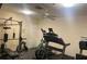 This exercise room features a weight machine and a treadmill at 2763 Woodgate Ln # 208, Sarasota, FL 34231