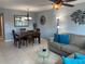 Cozy living room area with comfortable seating, dining table, and decorative accents at 2763 Woodgate Ln # 208, Sarasota, FL 34231