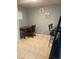 A cozy office featuring neutral walls, tiled floors, and a simple desk setup for focused work at 2763 Woodgate Ln # 208, Sarasota, FL 34231