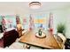 Open dining area with wood table and chairs, featuring views of the pool at 3158 Regatta Cir, Sarasota, FL 34231