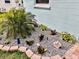 Professionally landscaped garden with an assortment of tropical plants at 3158 Regatta Cir, Sarasota, FL 34231