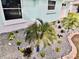 Beautiful landscaping with a variety of plants, rocks, and solar lights at 3158 Regatta Cir, Sarasota, FL 34231