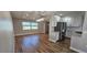 Dining area featuring modern lighting and a view of the kitchen and backyard at 3167 57Th Avenue E Cir, Bradenton, FL 34203