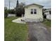 Charming yellow home with a well-maintained lawn and paved driveway at 3333 26Th E Ave # 1025, Bradenton, FL 34208
