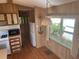 Efficient kitchen layout with essential appliances, ample natural light, and practical storage solutions at 3333 26Th E Ave # 1025, Bradenton, FL 34208