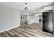 Open-concept layout features a bright kitchen and living space with modern flooring at 3389 Dunbar St, Port Charlotte, FL 33948