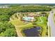 Community pool and recreation center from above, showcasing walking paths and serene pond views at 368 Snapdragon Loop, Bradenton, FL 34212