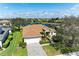 Aerial view of house with lake in the backyard surrounded by other homes at 368 Snapdragon Loop, Bradenton, FL 34212