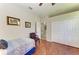 Bright bedroom with a closet, a ceiling fan, hardwood floors, and neutral paint tones at 368 Snapdragon Loop, Bradenton, FL 34212
