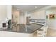 Bright kitchen featuring granite countertops, stainless steel appliances, and ample cabinet space at 368 Snapdragon Loop, Bradenton, FL 34212